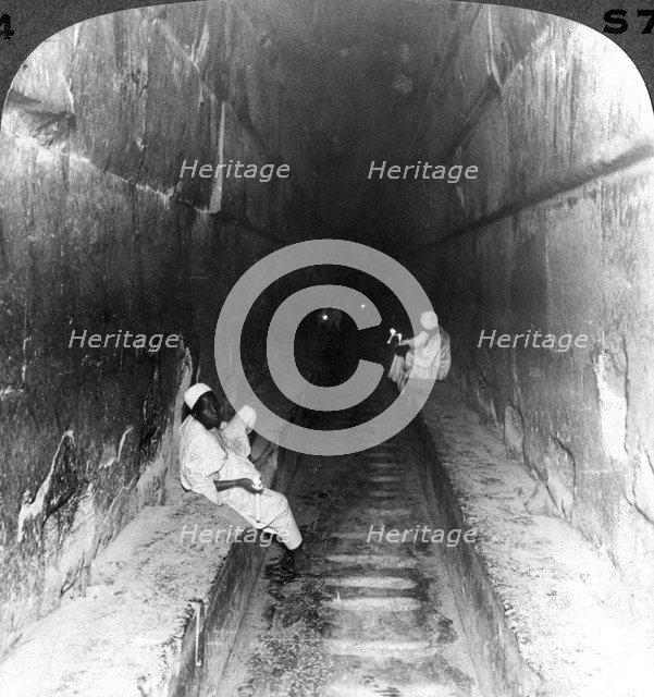 'Looking down the main passage to Khufu's sepulchre within the Great Pyramid, Egypt', 1905.Artist: Underwood & Underwood