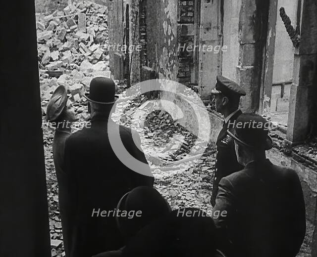 King George VI and Queen Elizabeth Inspecting Bomb Damage, 1942. Creator: British Pathe Ltd.