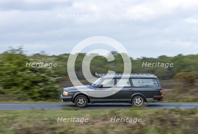 Volvo 244 Estate driving in New Forest, 2012. Creator: Tim Woodcock.