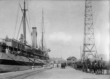 U.S.S. Memphis, Caskets of Dead, Brought Home By U.S. Hospital Ship 'Solace', 1916. Creator: Harris & Ewing.