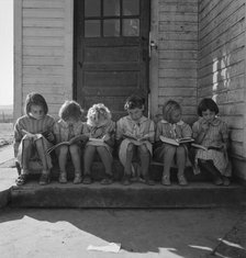 Girls of Lincoln Bench School study their reading lesson, near Ontario, Malheur County, Oregon, 1939 Creator: Dorothea Lange.