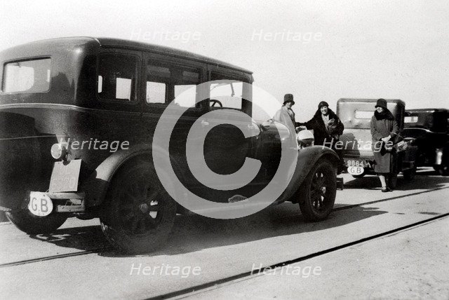 Women and parked cars, 1930. Artist: Unknown