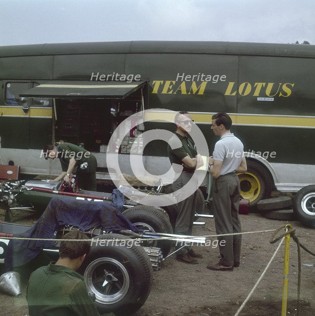 Chapman and Clark outside the Lotus team bus, French Grand Prix, Clermont-Ferrand, France, 1965. Artist: Unknown