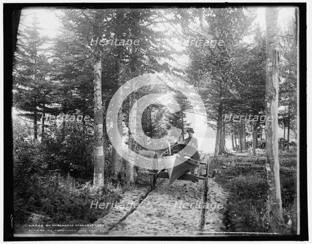 An Adirondack hand cart carry, c1902. Creator: William H. Jackson.