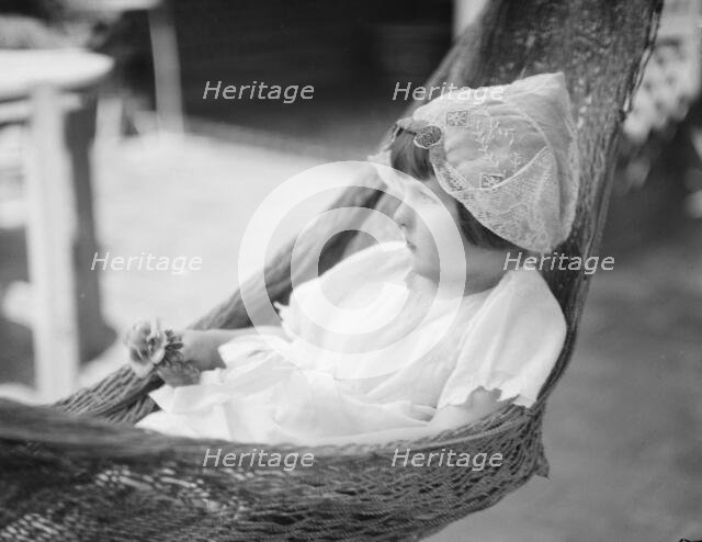 Rice, Isaac, Mrs., grandaughter of, in a hammock, 1920 July 26. Creator: Arnold Genthe.