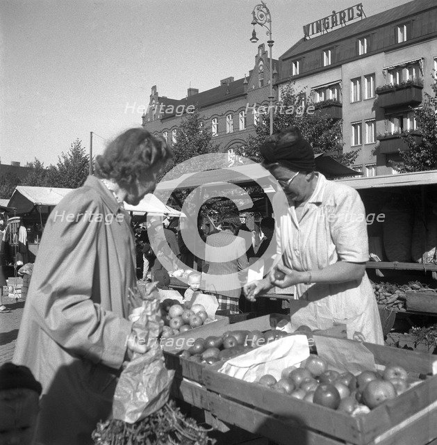 Fruit and vegetable stall in the market, Malmö, Sweden, 1947. Artist: Otto Ohm