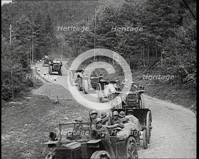 Cars Carrying Italian Troops Driving Through the Alps, 1930s. Creator: British Pathe Ltd.