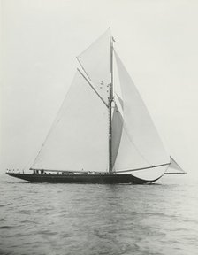 The 221 ton gaff-rigged cutter 'Britannia' sailing under spinnaker. Creator: Kirk & Sons of Cowes.