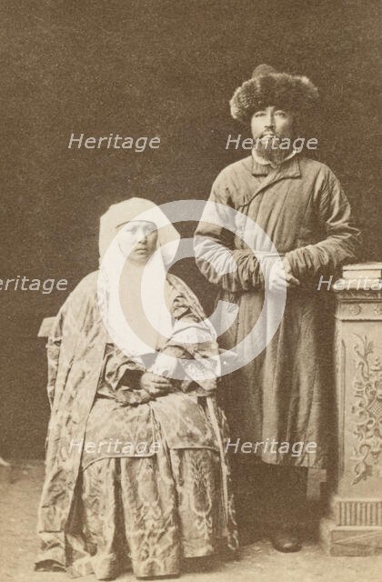Kazakh man and woman, full-length portrait, between 1870 and 1886. Creator: Unknown.