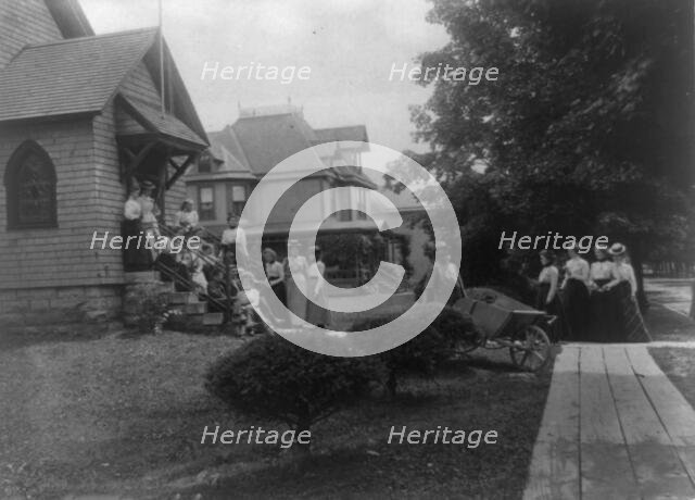 Group of women and a few boys outside Roycroft shop, East Aurora, N.Y., 1900. Creator: Frances Benjamin Johnston.