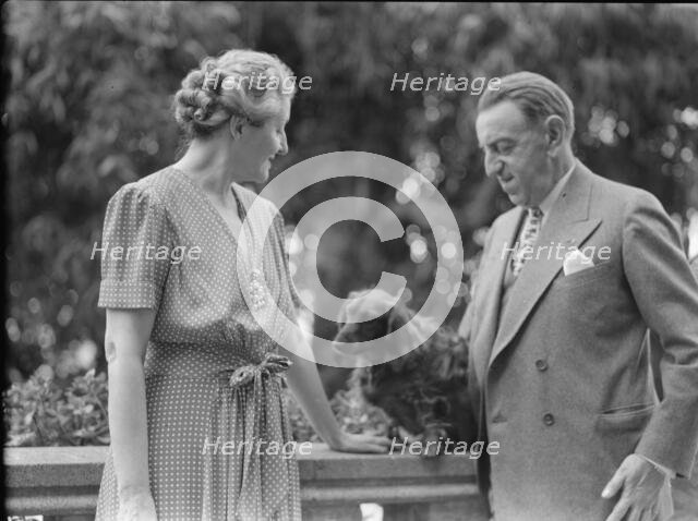 Alanson, Bertram, Mr. and Mrs., with dog, outdoors, between 1927 and 1937. Creator: Arnold Genthe.