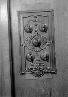 A bronze switch plate in the John Rylands Library, University of Manchester, 1942.   Creator: GB Wood.