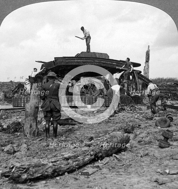 Engineers clearing a destroyed tank from a road, World War I, 1917-1918.Artist: Realistic Travels Publishers