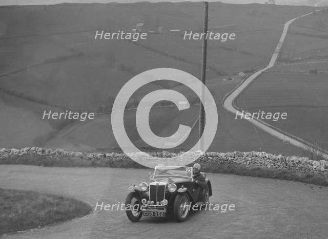 MG TA of WC Reid competing in the RAC Rally, 1939. Artist: Bill Brunell.