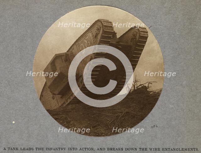 A tank leads the infantry into action and breaks down the wire entanglements. 1915 (1921). Creator: HD Girdwood.