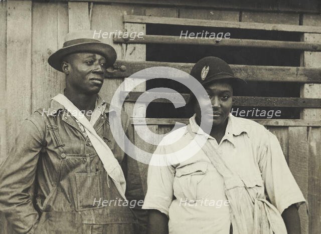 Cotton pickers receiving sixty cents a day, Pulaski County, Arkansas, October 1935. Creators: Farm Security Administration, Ben Shahn.