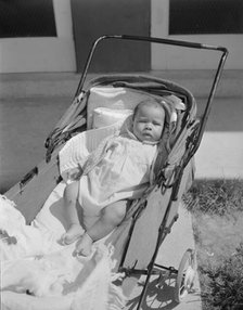 Baby taking a sun bath, Frederick Douglass housing project, Anacostia, D.C., 1942. Creator: Gordon Parks.