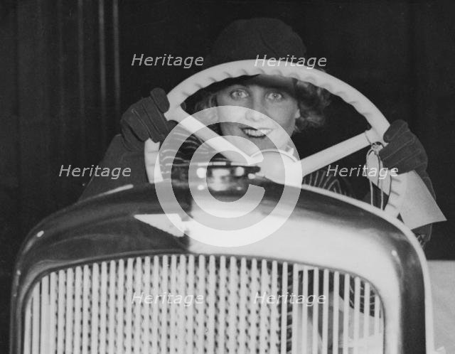 Female model in Hillman Minx at 1933 Motor Show. Creator: Unknown.