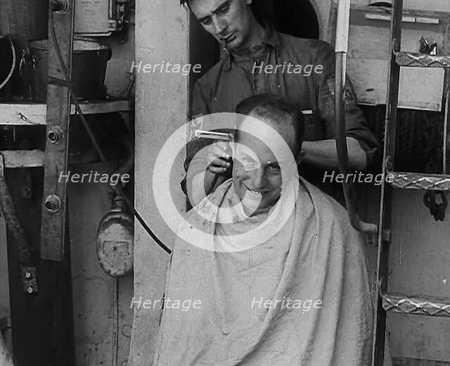 A Sailor Getting his Hair Cut, 1943. Creator: British Pathe Ltd.