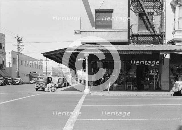 Secondhand store, street corner of San Joaquin Valley town on U.S. 99, Fresno, CA, 1939. Creator: Dorothea Lange.
