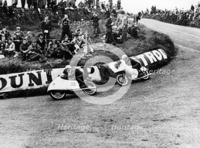 Rupert Hollaus on bike number 23, Carlo Ubbiali on bike number 7, 1954. Artist: Unknown
