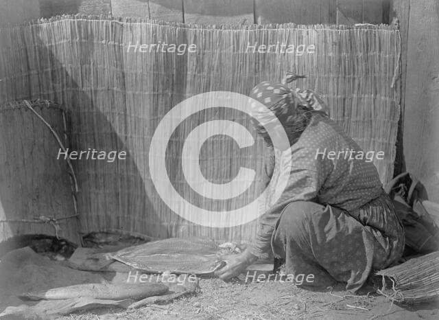 Preparing salmon-Wishram, c1910. Creator: Edward Sheriff Curtis.