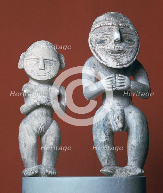 Male and female ancestor figures from Melanesia. Artist: Unknown