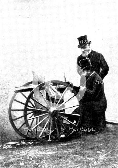 The Prince of Wales firing a Maxim Gun: Mr. Maxim standing by, 1898. Creator: Russell & Sons.