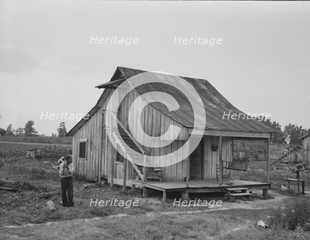 Cottonworker's cabin with outside stairway and loft, near Blytheville, Arkansas, 1937. Creator: Dorothea Lange.
