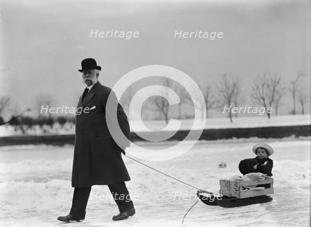 Skating Party - Unidentified Man Pulling Child On Sled, 1912. Creator: Harris & Ewing.