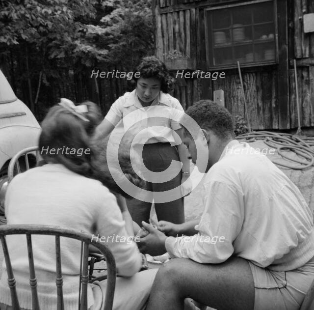 Campers helping with the kitchen work at Camp Ellen Marvin, Arden, New York, 1943. Creator: Gordon Parks.