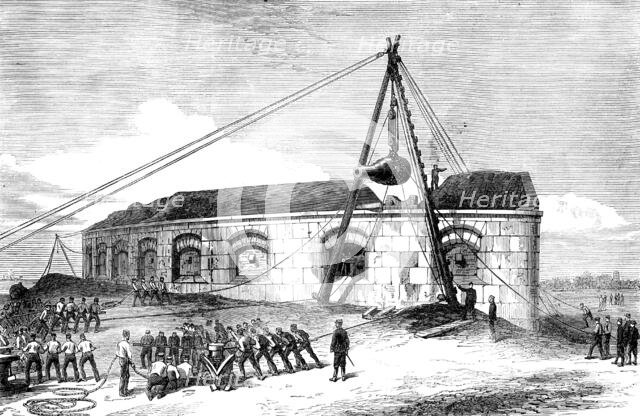 Raising a 25-ton gun at the Gilkicker Battery, Portsmouth, 1871. Creator: Unknown.