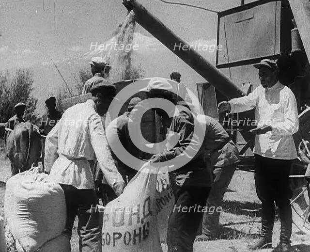 Russian Civilians Gathering Grain, 1941. Creator: British Pathe Ltd.