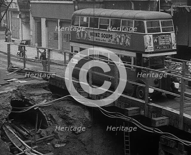 A Bus Driving Across a Wooden Bridge, 1940. Creator: British Pathe Ltd.