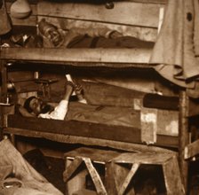 Soldiers in wooden bunks, c1914-c1918. Artist: Unknown.