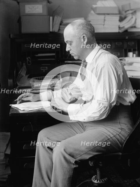 Unknown politician at desk, 1912. Creator: Harris & Ewing.
