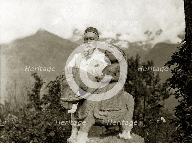 Nicholas Roerich by the equestrian statue of Guga Chauhan at the Kullu Valley, 1932-1933.