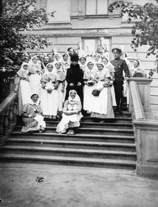 Dowager Empress Maria Feodorovna of Russia with nurses outside a hospital, Russia, 1916. Artist: Unknown
