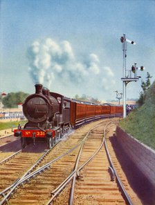 'Leaving Dublin. Great Southern Railways train, hauled by a 4-4-0 passenger express', 1935. Creator: Unknown.