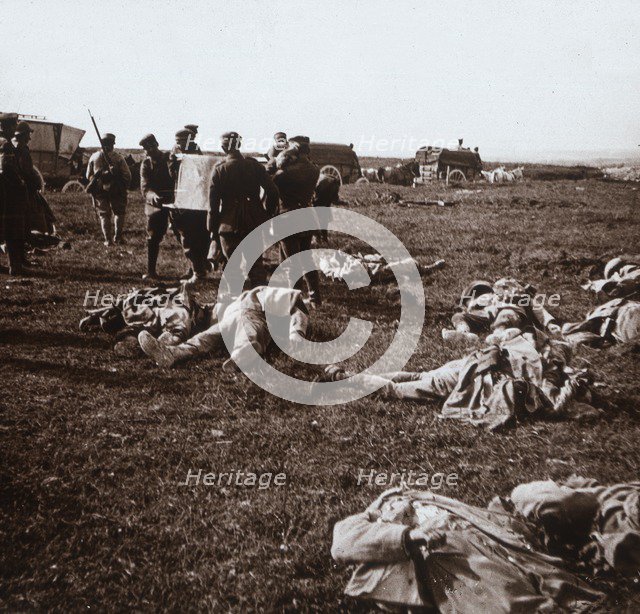 Burying bodies, Sainte-Marie-à-Py, northern France, c1914-c1918. Artist: Unknown.