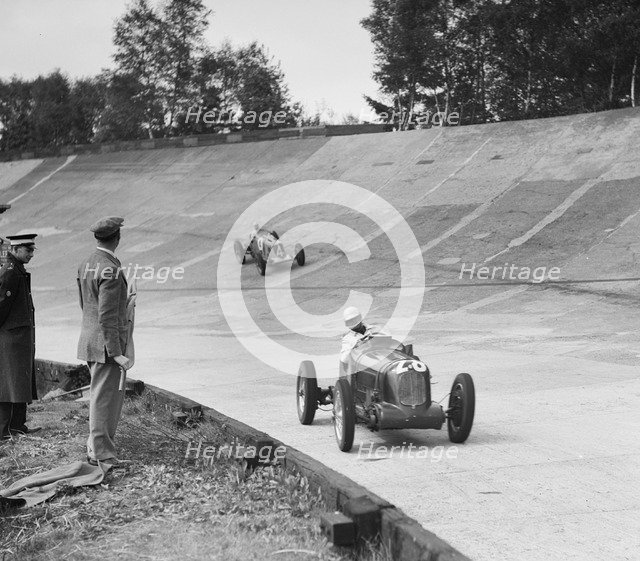 Reg Parnell's MG K3 leading B Bira's Maserati, JCC International Trophy, Brooklands, 2 August 1937.  Artist: Bill Brunell.