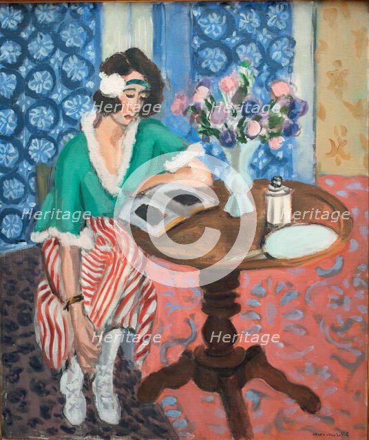 Reading woman at the table, 1921. Creator: Henri Matisse.