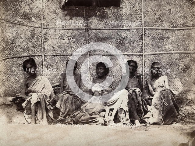 Famine in Mysore, India: six emaciated women, five sitting and one leaning on another's lap, 1876-78 Creator: Willoughby Wallace Hooper.