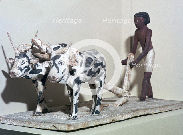 Wooden model of a man ploughing with oxen, from Egypt, Middle Kingdom, c2040-1750 BC. Artist: Unknown