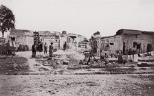 [Encampment with shacks and laundry]. Brady album, p. 129, 1861-65. Creator: Unknown.