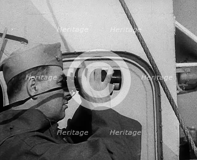 A Sailor Using Binoculars, 1943. Creator: British Pathe Ltd.