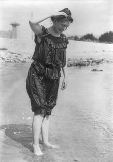 Frances Benjamin Johnston, standing in surf in wet bathing suit, n.d.. Creator: Frances Benjamin Johnston.