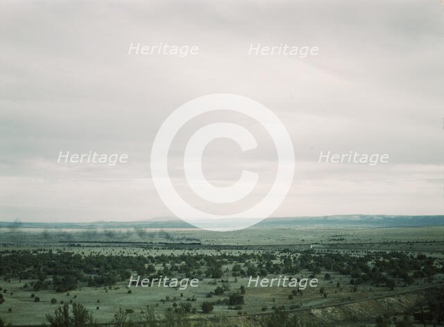 Santa Fe R.R. freight train rounding a curve between Ash Fork and Gleed, Arizona, 1943. Creator: Jack Delano.