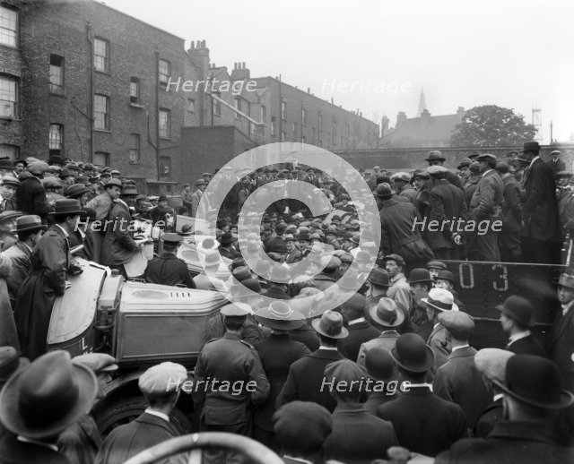 Car auction in Brixton Road, Brixton, London, 1919. Artist: Bedford Lemere and Company
