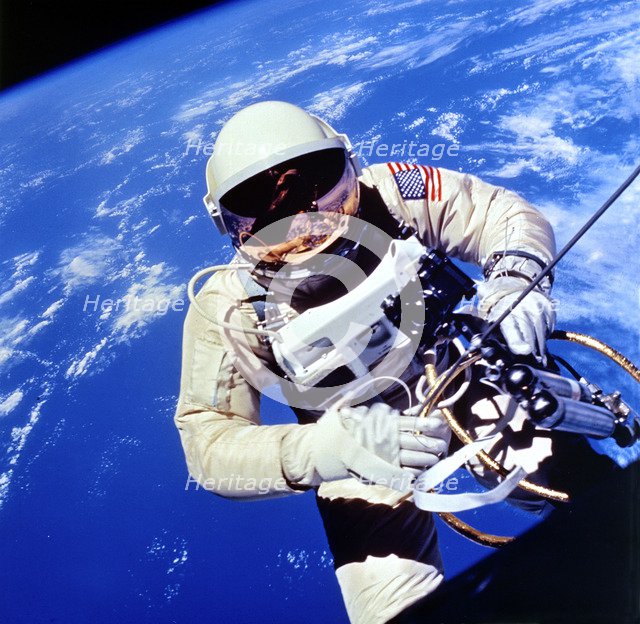 US Astronaut Edward H. White II carrying out external tasks. Artist: Unknown